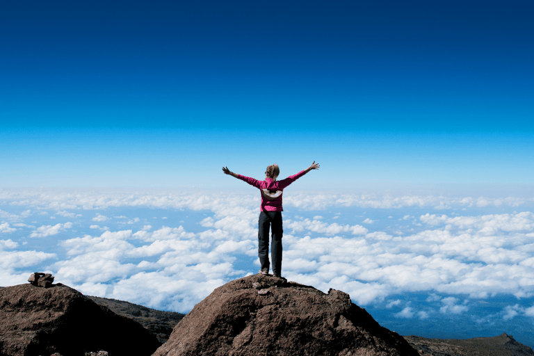 africa-tanzania-kilimanjaro-above-clouds-woman-hike