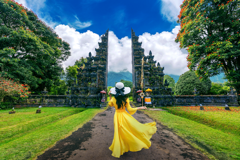 asia-indonesia-bali-handara-gate-woman-yellow-dress-blue-sky