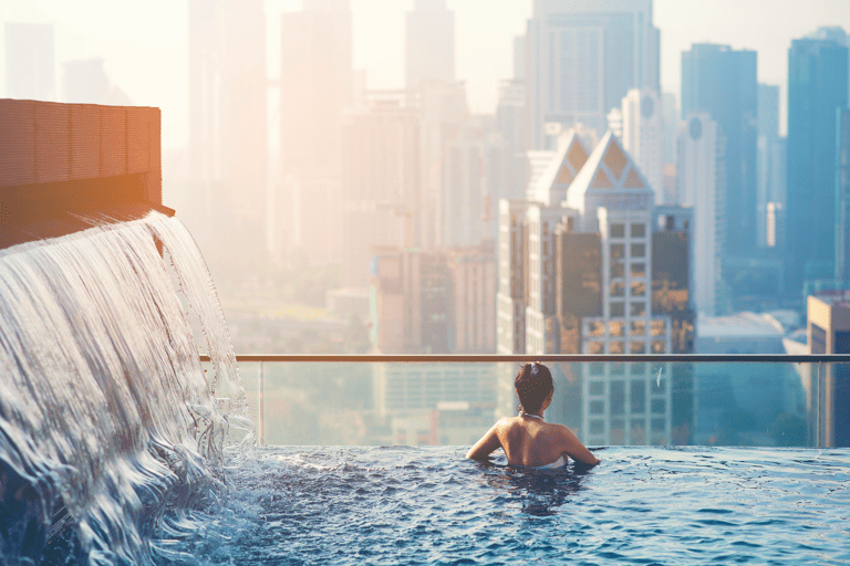 asia-singapore-skyscraper-hotel-pool-woman-city-view