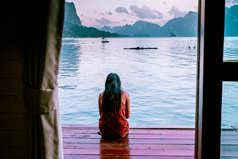 asia-thailand-floating-bungalow-woman-sitting-looking