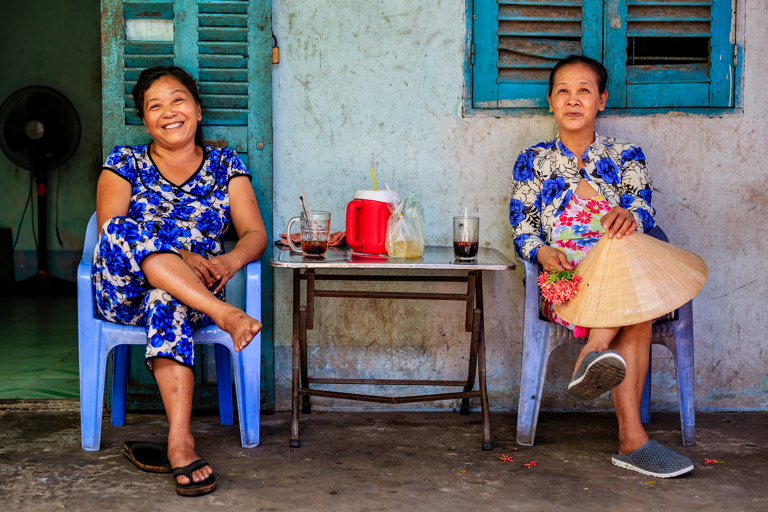 asia-vietnam-two-woman-sitting-outside-culture