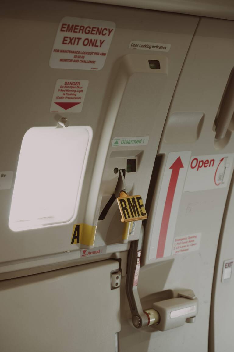 exit-sign-plane-dangerous-travel