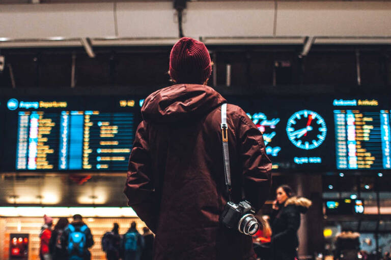 general-man-watching-airport-departure-details