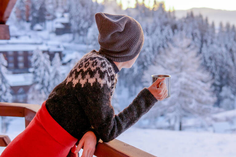 general-woman-winter-clothes-looking-from-balcony