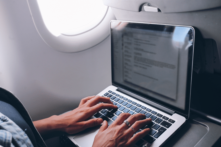 generic-airplane-woman-using-laptop-in-flight