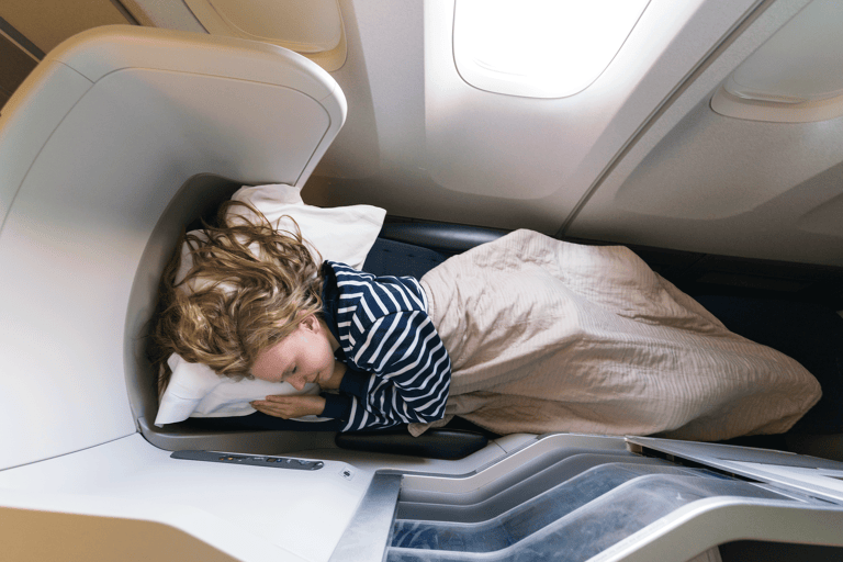 generic-business-class-female-traveler-sleeping-bed