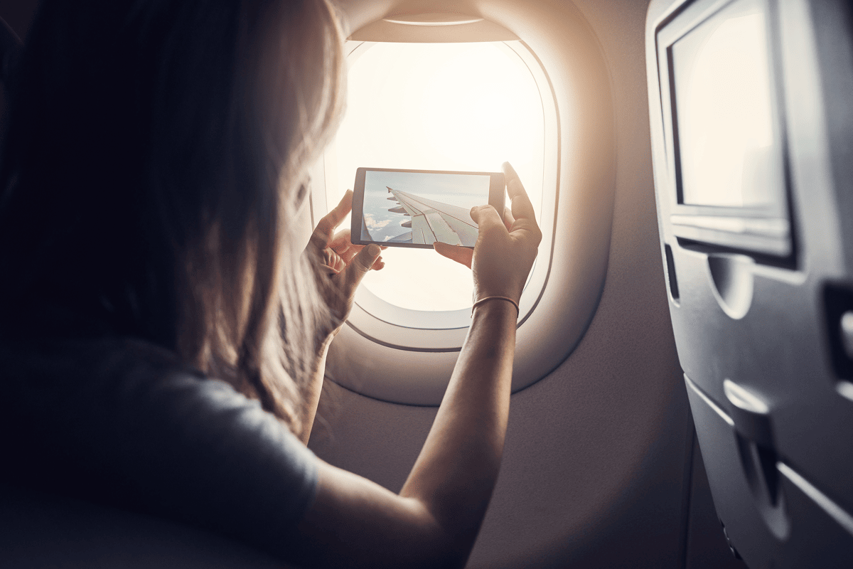 Why should we switch on Airplane Mode while flying?