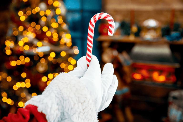 generic-christmas-santa-hand-holding-candy-cane