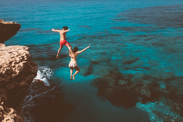 generic-couple-jumping-in-water