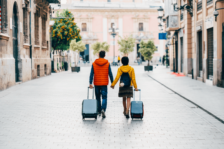 generic-couple-suitcases-street