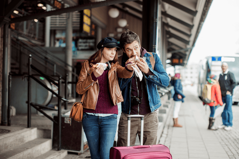 generic-couple-travelling-eating-luggage-food