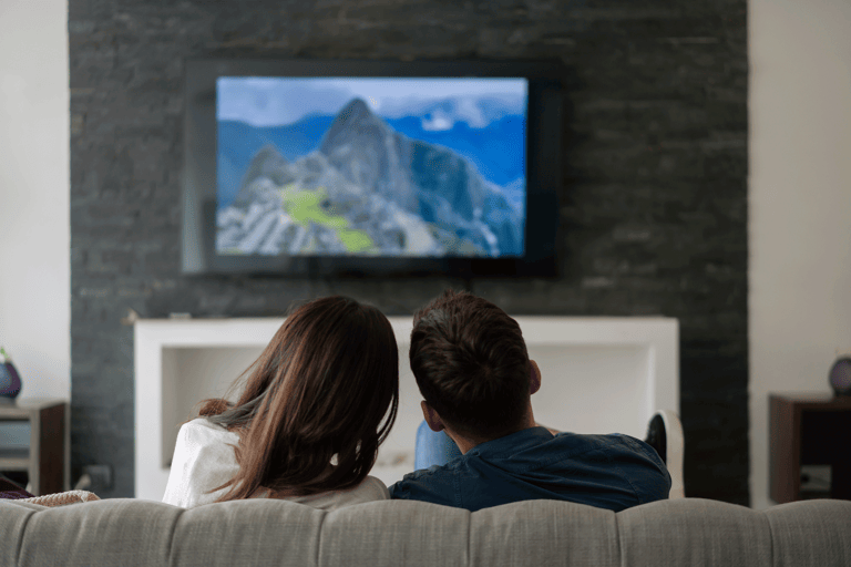 generic-couple-watching-tv-screen-machu-picchu