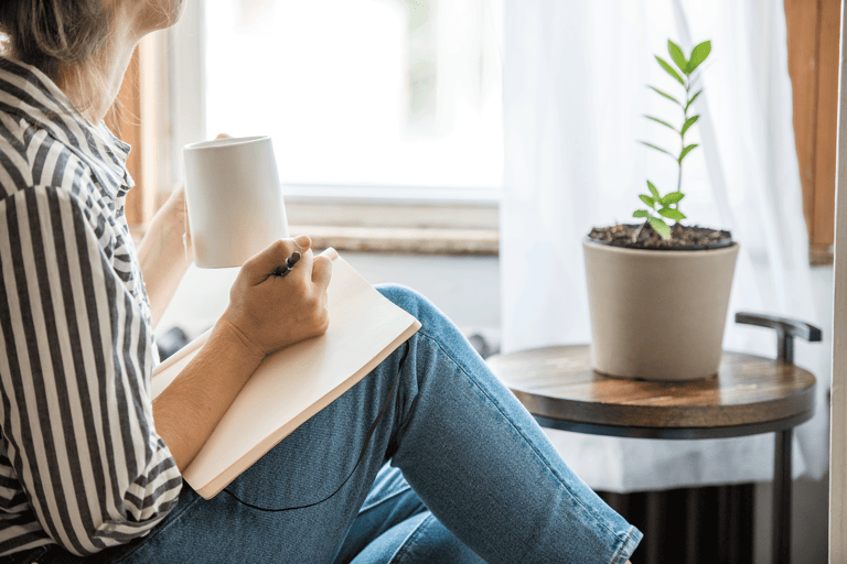 generic-female-looking-out-thinking-writing