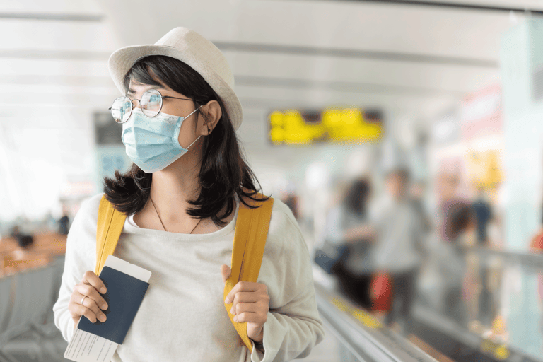 generic-female-with-mask-airport-passport-in-hand
