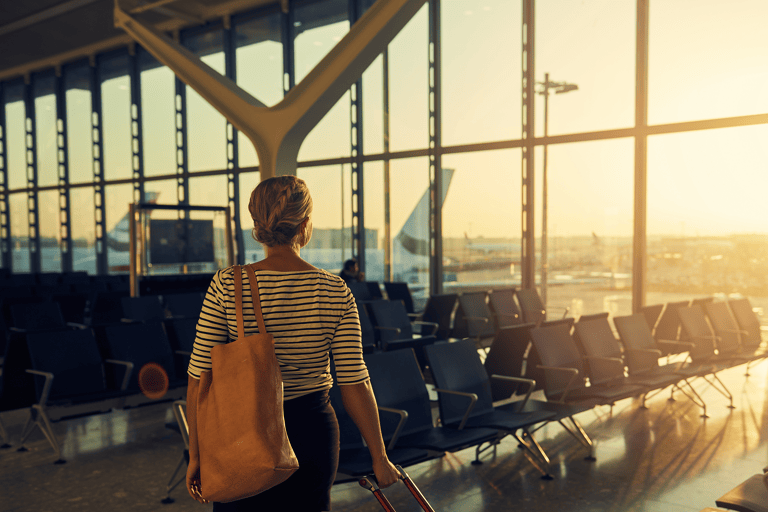 generic-girl-airport-sunset-suitcase-empty