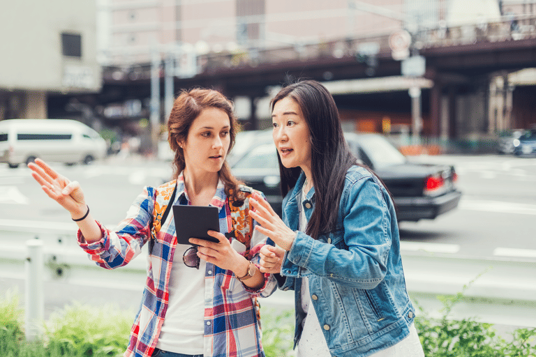 generic-girls-asking-road-map-directions