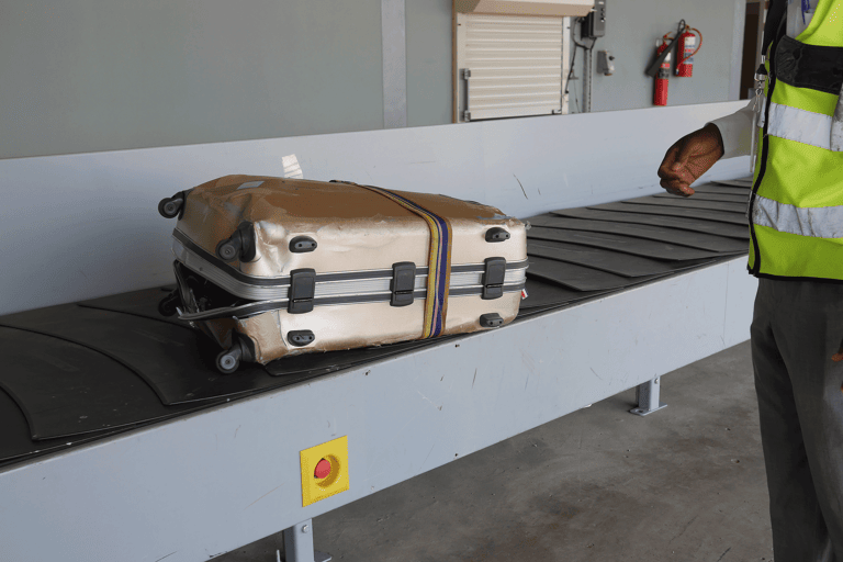 generic-luggage-suitcase-damaged-conveyer-belt-airport