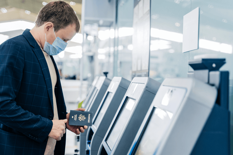 generic-man-check-in-self-kiosk-wear-mask