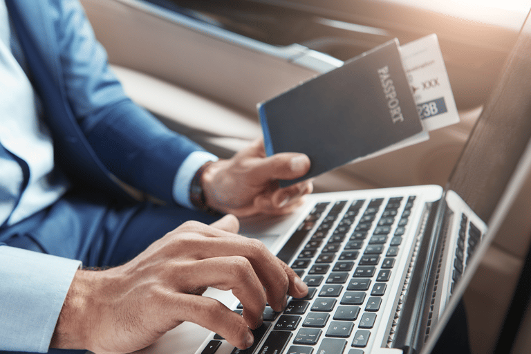 generic-man-laptop-passport-flight-ticket