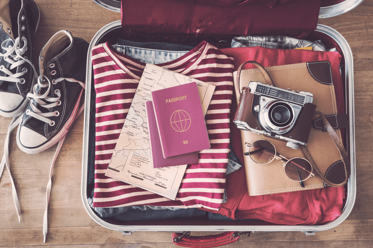generic-packing-passport-travel-money-suitcase-map-camera