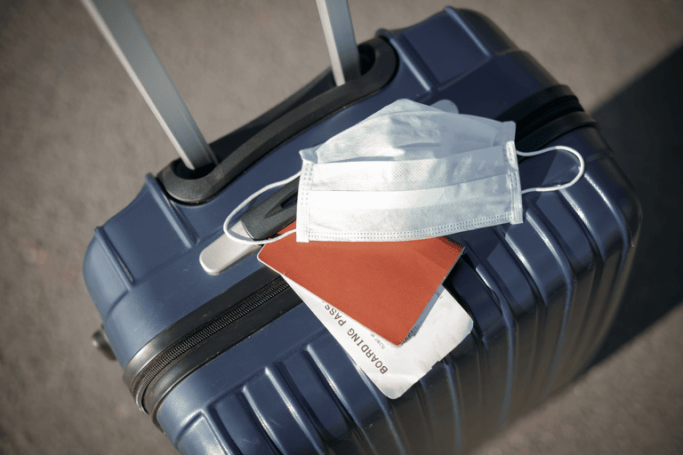 generic-suitcase-mouth-mask-corona-passport-boarding-pass