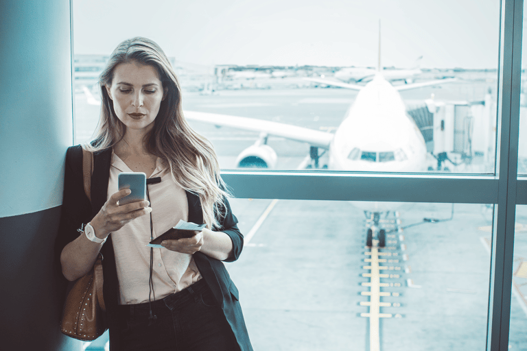 generic-woman-check-tickets-airport-phone