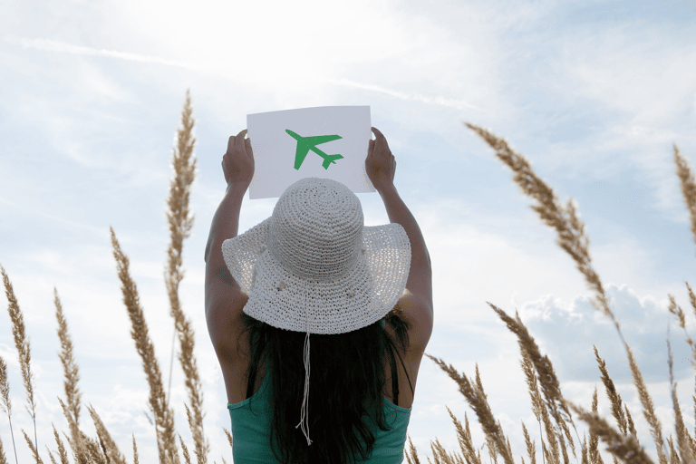generic-woman-holding-paper-plane-in-the-air-sustainability