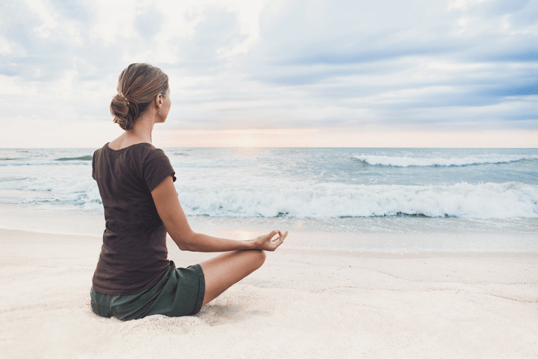 generic-woman-meditating-beach