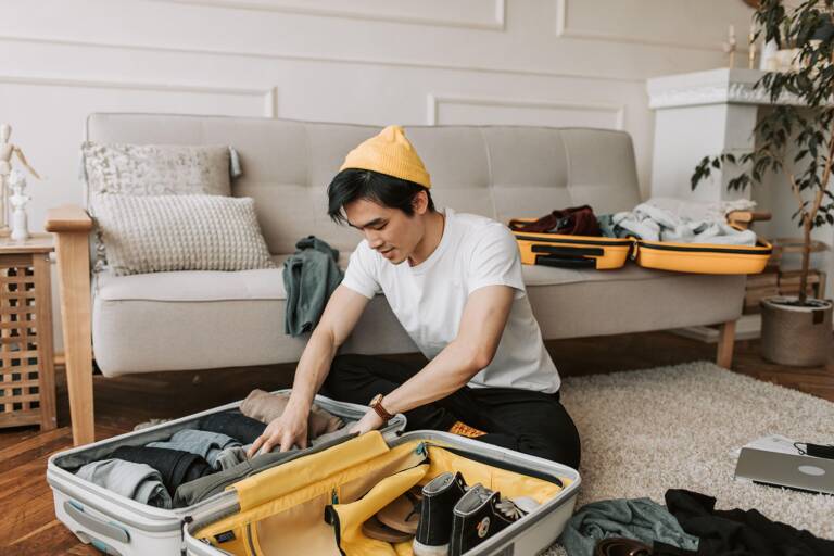 man-packing-luggage-for-trips