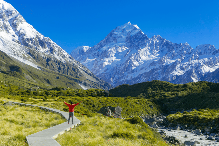 oceania-new-zealand-mt-cook-area-hiker-trekking-blue-sky